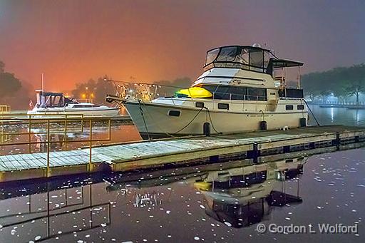 Docked Boats Under Foggy Night Sky_35164.jpg - Photographed along the Rideau Canal Waterway at Smiths Falls, Ontario, Canada.